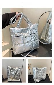 Detail of silver quilted tote bag with metallic finish and front snap button pocket