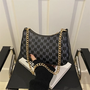 Minimalist black crescent shoulder bag with grey M pattern and gold chain strap