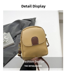 Detail of khaki pebbled PU leather mini crossbody bag with gold-tone metal hardware