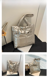 Detail of gold quilted tote bag with metallic finish and front snap button pocket