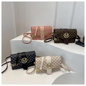 Detailed view of four classic flap bags with M-monogram pattern and metal logo