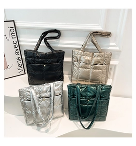 Quilted puffer tote bags displayed in four colors with glossy finish and snap pockets