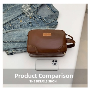 Trousse de toilette en cuir PU marron avec surpiqûres blanches et poignée avec téléphone