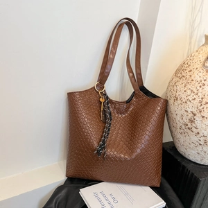 Brown woven texture large tote bag with tassel pendant and slim shoulder straps