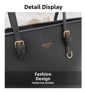 Detail of black Saffiano leather tote with gold hardware and logo branding