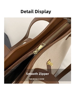 Détail de la fermeture éclair dorée lisse sur le sac cabas en toile et cuir de qualité
