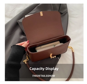Internal view of brown flap bag showing capacity for phone and cosmetics