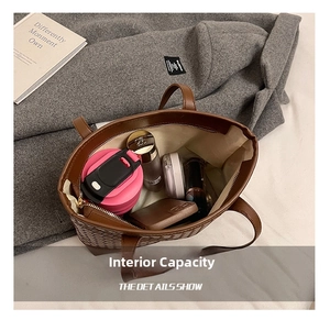Interior view showing the large capacity of the dark brown woven leather tote bag