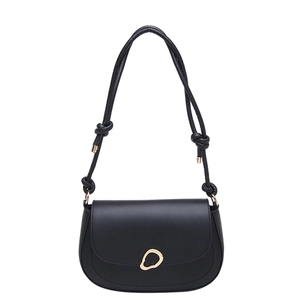Minimalist black leather underarm bag with gold ring buckle and knotted shoulder strap