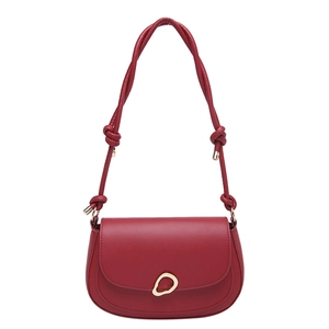 Vintage burgundy matte leather saddle bag with gold buckle and knotted shoulder strap