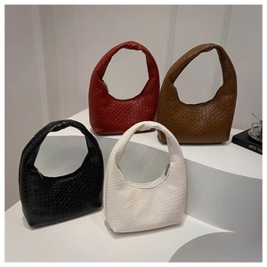 Detailed collection of woven hobo bags in four colors with knotted handles and textures