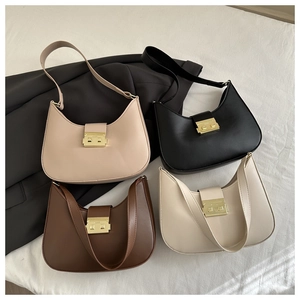 Collection of hobo shoulder bags in beige, black, brown and cream with gold buckles