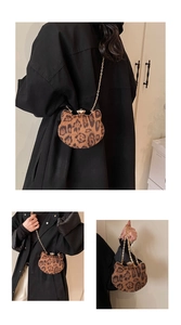 Detailed views of leopard print cat-shaped crossbody bag with gold chain and metal clasp