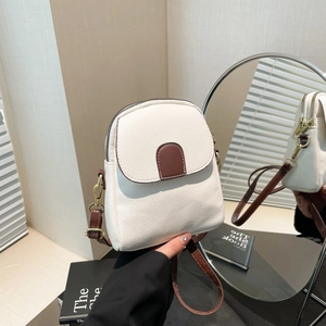 Chic beige crossbody phone bag with brown strap and litchi texture in a lifestyle setting