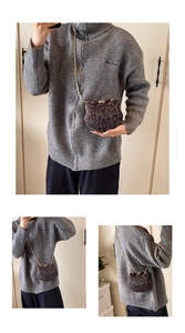 Detail views of leopard print cat-shaped crossbody bag with gold chain strap