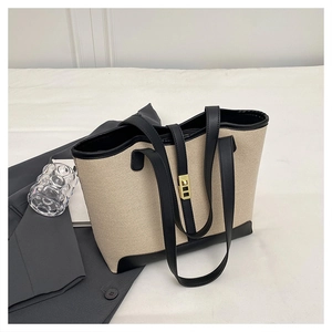 Grand sac cabas en toile avec garniture en cuir noir et boucle en métal doré