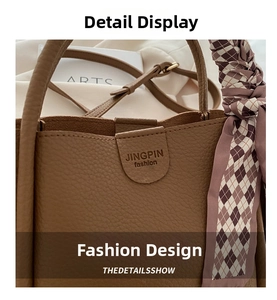 Detailed macro view of brown litchi pattern leather tote with a checkered silk scarf