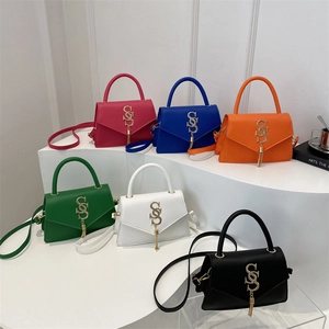 Women PU Leather Shoulder Crossbody Bag With Metal Letter Logo And Tassel Fashion Flap Handbag Chic Versatile