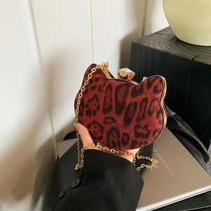 Cat-shaped leopard print shoulder bag with gold metal frame and rhinestone top clasp