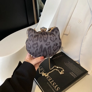 Cat-shaped velvet evening clutch with leopard print, gold frame and rhinestone clasp