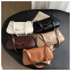 Detailed view of five stylish underarm bags with gold rivets in various neutral colors