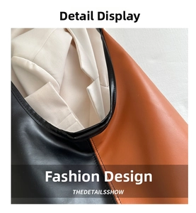 Detailed close-up of tricolor leather and fabric patchwork with fine stitching on tote bag