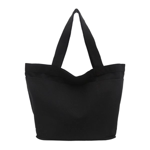 Minimalist black canvas tote bag with wide straps and large capacity for daily commuting