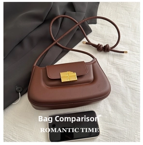 Detail of coffee brown crescent bag with a unique chocolate-shaped gold metal buckle