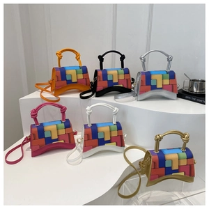 Detail showing various patchwork geometric patterns on hourglass-shaped crossbody bags