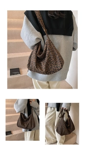 Detailed view of spacious leopard print hobo bag with adjustable canvas shoulder strap