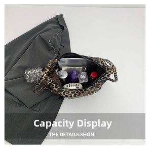 Top view of large leopard print bucket bag showing spacious interior with daily essentials