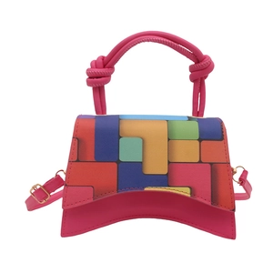 Pink mini handbag with colorful geometric pattern and unique curved base for women