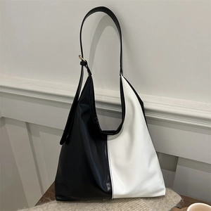 Minimalist black and white color-block large tote bag with adjustable shoulder strap