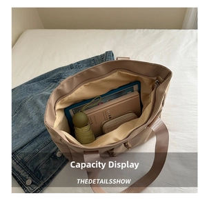 Interior view showing large capacity for tablet and umbrella in grey canvas tote bag