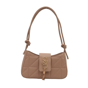 Beige quilted hobo bag with gold SS logo and tassel detail on a clean white background