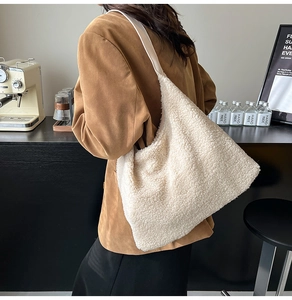 Detail shot of the plush lamb wool tote bag showing its soft texture and large capacity