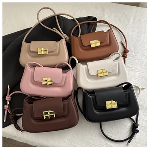 Collection of minimalist saddle bags in six colors with gold chocolate-shaped metal buckles