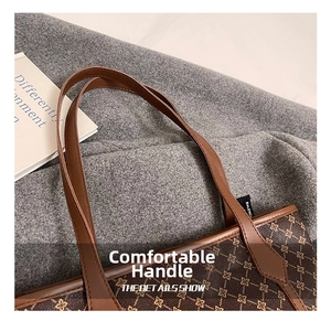Close-up of comfortable brown leather handle on a vintage floral print tote bag