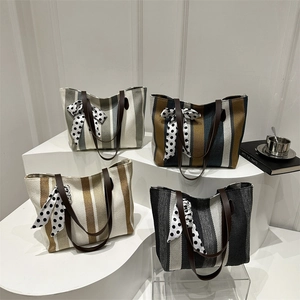Striped canvas tote bags with polka dot scarf and leather handles in four colors