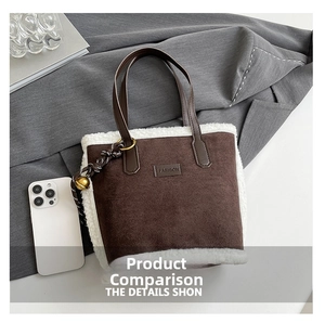 Detail of a brown suede bucket bag with white faux shearling trim and fashion label