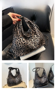 Detail of coffee leopard print bucket bag with gold hardware and adjustable strap