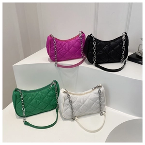 Detailed display of four colorful quilted crescent armpit bags with metallic chains