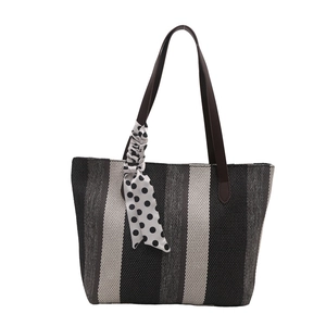 Vertical striped canvas tote bag with dark brown handles and polka dot scarf detail
