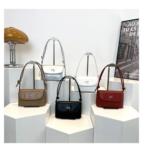 Detailed display of vintage crossbody bags in five colors with silver bow metal buckles