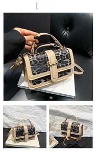 Detail of khaki leopard print PU handbag featuring gold metal clasp and adjustable strap