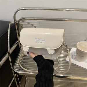 Chic cream white saddle bag with FASHION IN STINCE print for stylish daily wear