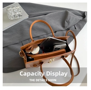 Top view of brown crocodile pattern handbag showing spacious interior for tablet and daily items