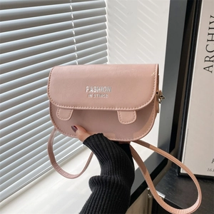 Minimalist light pink PU leather saddle bag with silver lettering and crossbody strap
