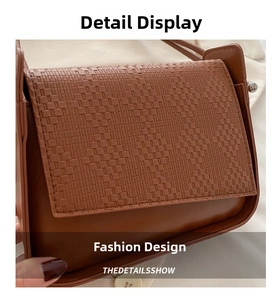 Close-up of brown faux leather shoulder bag featuring intricate woven texture and flap