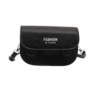Minimalist black faux leather saddle bag with silver lettering on white background